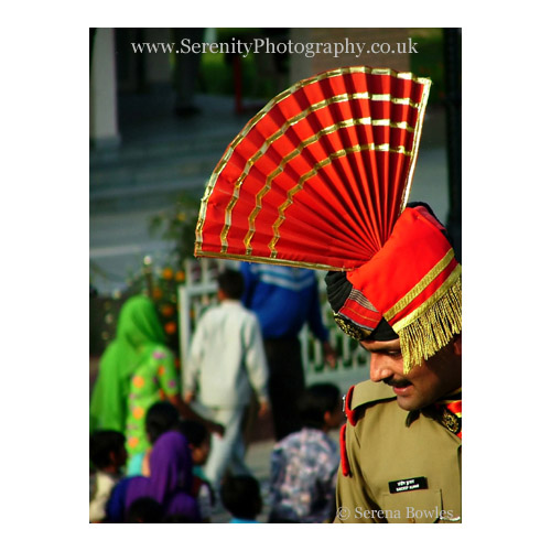 Indian border guard in an ornate red hat at the Wagha Border with Pakistan.